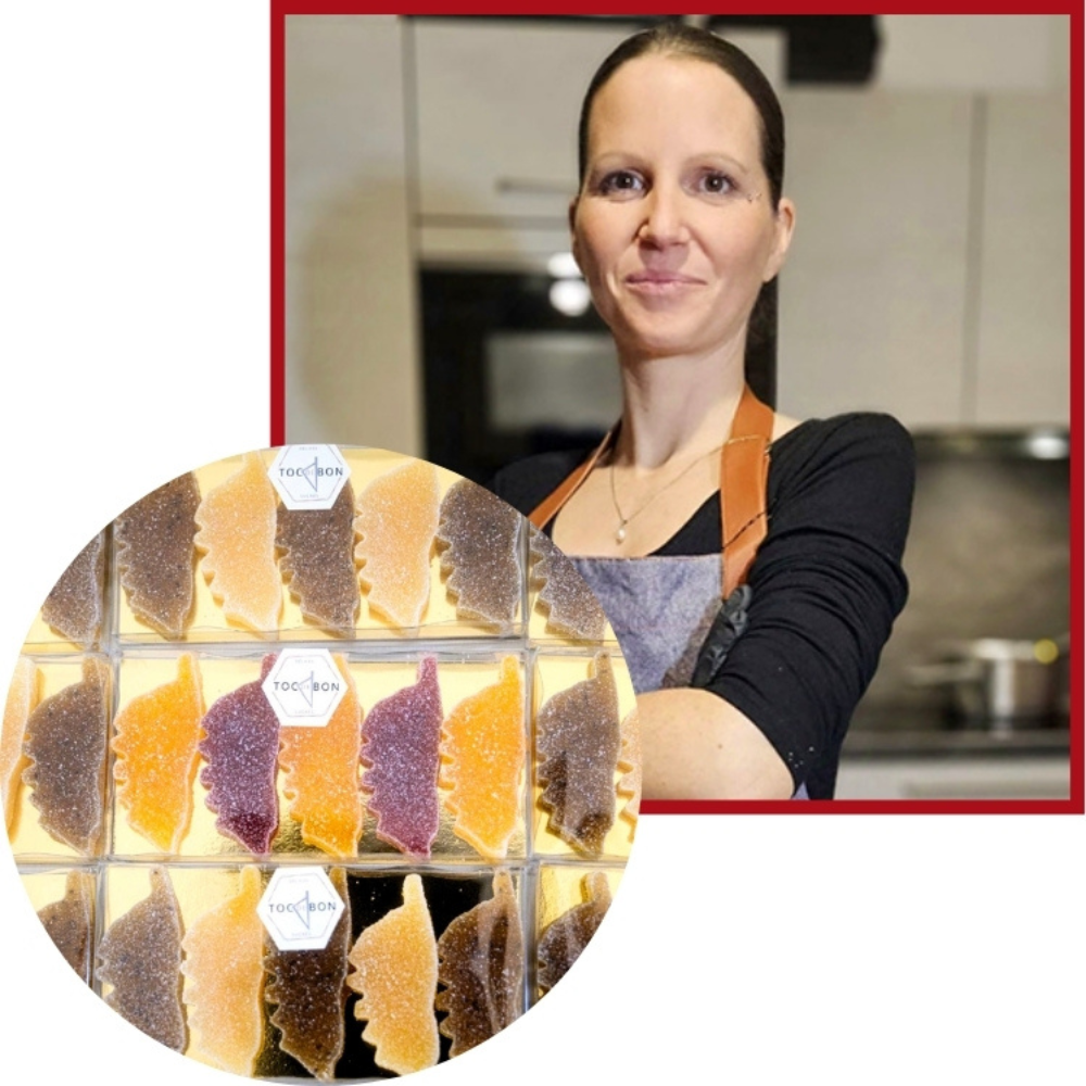 Artisane posant avec ses pâtes de fruit corse